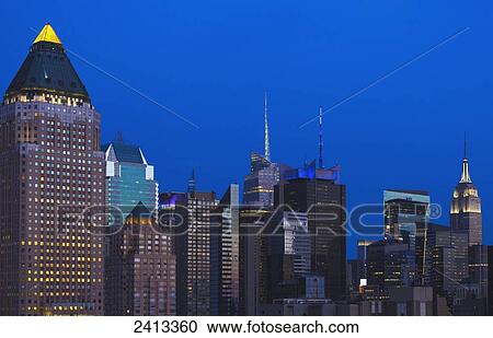 Stock Image - Empire State Building and Midtown Skyscrapers, Manhattan; New York City, New York, United States of America. Fotosearch