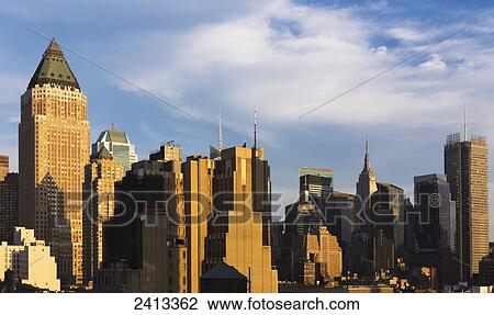 Stock Image - Empire State Building and Midtown Skyscrapers, Manhattan; New York City, New York, United States of America. Fotosearch