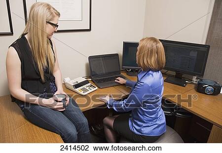Employer training intern at an accounting office; Edmonton, Alberta, Canada View Large Photo Image Stock Image - Employer training intern at an accounting office; Edmonton, Alberta, Canada. Fotosearch