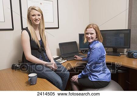 Employer training intern at the accounting office; Edmonton, Alberta, Canada View Large Photo Image Stock Photography - Employer training intern at the accounting office; Edmonton, Alberta, Canada. Fotosearch