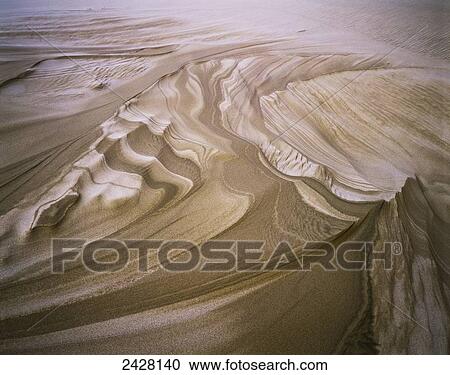 Stock Image - Erosion reveals layers of sand; Lakeside, Oregon, United States of America. Fotosearch