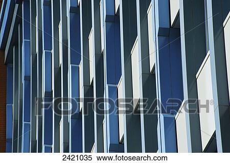 Stock Photography - Facade of a building with three tones of blue and white; London, England. Fotosearch