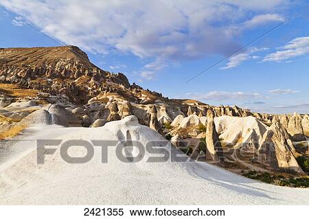 Stock Photography - Fairy chimneys in the rugged, barren landscape; Cappadocia, Turkey. Fotosearch