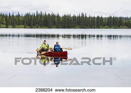 Family in red canoe on Byers Lake with green tree covered shoreline, Denali State Park; Alaska, Alaska, United States of America View Large Photo Image Picture - Family in red canoe on Byers Lake with green tree covered shoreline, Denali State Park; Alaska, Alaska, United States of America. Fotosearch