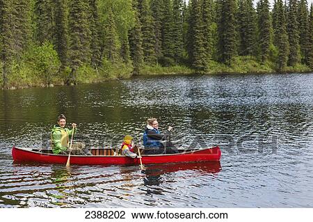 Family in red canoe on Byers Lake with green tree covered shoreline, Denali State Park; Alaska, Alaska, United States of America View Large Photo Image Stock Image - Family in red canoe on Byers Lake with green tree covered shoreline, Denali State Park; Alaska, Alaska, United States of America. Fotosearch