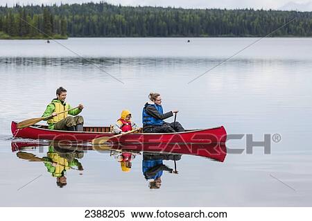 Family in red canoe on Byers Lake with green tree covered shoreline, Denali State Park; Alaska, Alaska, United States of America View Large Photo Image Stock Photography - Family in red canoe on Byers Lake with green tree covered shoreline, Denali State Park; Alaska, Alaska, United States of America. Fotosearch