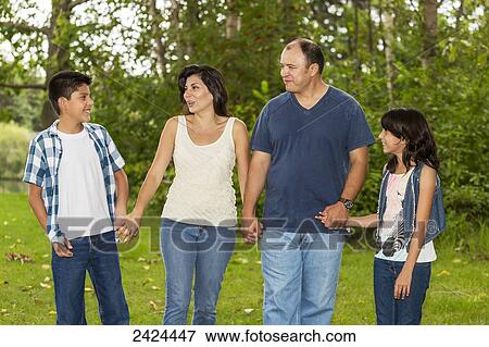 Family spending quality time together in a park; Edmonton, Alberta, Canada View Large Photo Image Stock Photo - Family spending quality time together in a park; Edmonton, Alberta, Canada. Fotosearch