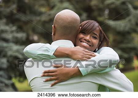 Stock Photograph - Father and daughter spending quality time together in a park; Edmonton, Alberta, Canada. Fotosearch