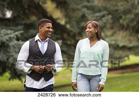 Stock Photograph - Father and daughter spending quality time together in a park; Edmonton, Alberta, Canada. Fotosearch