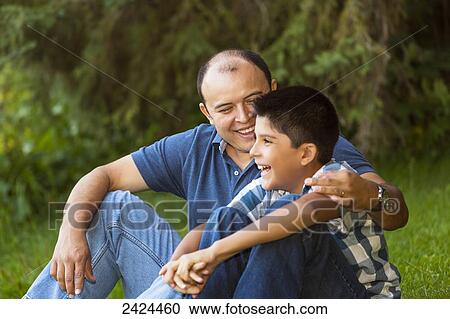Father and son spending quality time together in a park; Edmonton, Alberta, Canada View Large Photo Image Stock Image - Father and son spending quality time together in a park; Edmonton, Alberta, Canada. Fotosearch