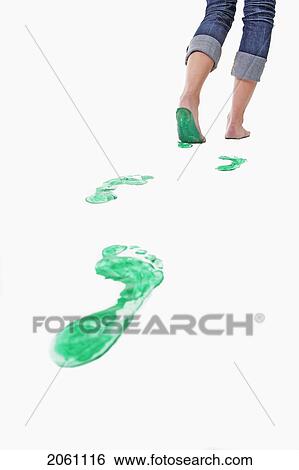 Stock Photograph - Feet Walking Leaving A Set Of Green Footprints. Fotosearch