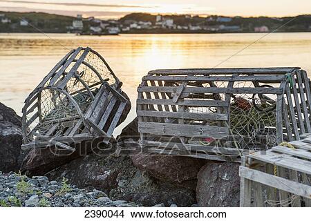 Picture - Fishing traps on the rocks at the water's edge; Twillingate, Newfoundland and Labrador, Canada. Fotosearch