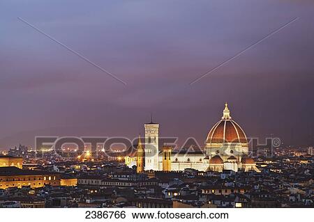 Stock Photograph - Florence Cathedral illuminated at dusk; Florence, Tuscany, Italy. Fotosearch