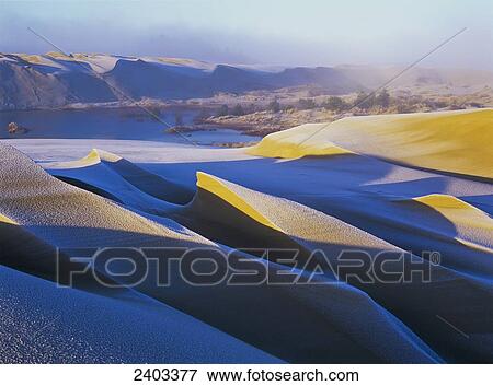 Stock Photo - Frost and sunlight decorate the sand dunes; Lakeside, Oregon, United States of America. Fotosearch