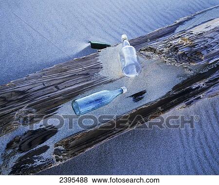 Glass bottles wash ashore at Umpqua Beach; Winchester Bay, Oregon, United States of America View Large Photo Image Stock Photo - Glass bottles wash ashore at Umpqua Beach; Winchester Bay, Oregon, United States of America. Fotosearch