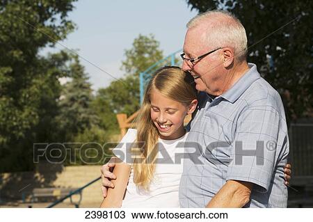 Grandfather and granddaughter spending quality time together in a park; Edmonton, Albert, Canada View Large Photo Image Stock Image - Grandfather and granddaughter spending quality time together in a park; Edmonton, Albert, Canada. Fotosearch