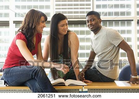 Group Of 3 Students Seated Casually In Classroom, In Front Of Solar Panelled Windows, Winnipeg, Canada View Large Photo Image Stock Image - Group Of 3 Students Seated Casually In Classroom, In Front Of Solar Panelled Windows, Winnipeg, Canada. Fotosearch