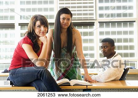 Group Of 3 Students Seated Casually In Classroom, In Front Of Solar Panelled Windows, Winnipeg, Canada View Large Photo Image Stock Image - Group Of 3 Students Seated Casually In Classroom, In Front Of Solar Panelled Windows, Winnipeg, Canada. Fotosearch