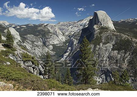 Stock Image - Half Dome Rock from the back of Yosemite Valley, the view from Glacier Point, Yosemite National Park; California, United States of America. Fotosearch