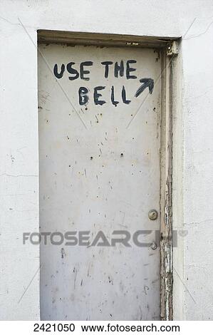 Hand writing on a door saying use the bell with an arrow pointing to the doorbell; London, England View Large Photo Image Stock Image - Hand writing on a door saying use the bell with an arrow pointing to the doorbell; London, England. Fotosearch