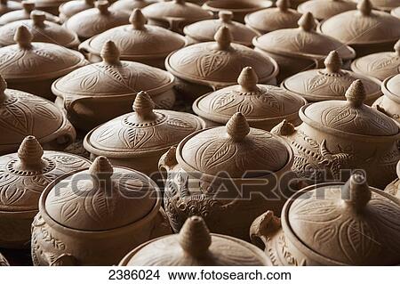 Picture - Handmade black pottery before firing; Zhongdian, Yunnan, China. Fotosearch