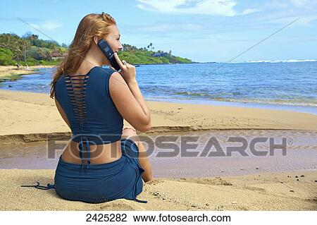 Hawaii, a redheaded woman talking on her cell phone. View Large Photo Image Stock Image - Hawaii, a redheaded woman talking on her cell phone.. Fotosearch