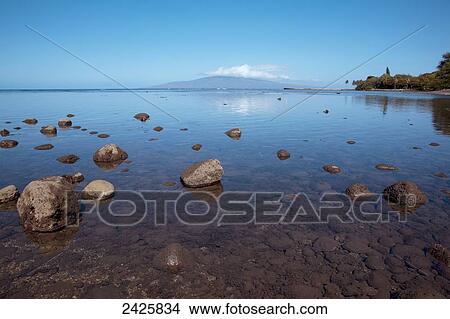 Hawaii, Maui, A close up view of rocks and reflections at low tide View Large Photo Image Picture - Hawaii, Maui, A close up view of rocks and reflections at low tide. Fotosearch