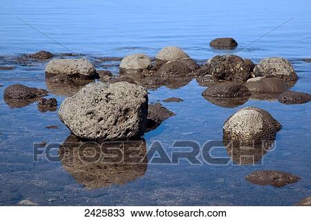 Hawaii, Maui, A close up view of rocks and reflections at low tide View Large Photo Image Stock Image - Hawaii, Maui, A close up view of rocks and reflections at low tide. Fotosearch
