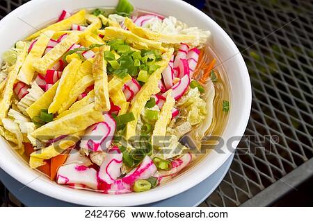 Stock Photograph - Hawaii, Maui, A fresh and colorful bowl of local Saimin.. Fotosearch
