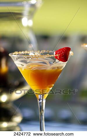 Hawaii, Maui, A tropical Mango Martini with strawberry garnish. View Large Photo Image Stock Image - Hawaii, Maui, A tropical Mango Martini with strawberry garnish.. Fotosearch