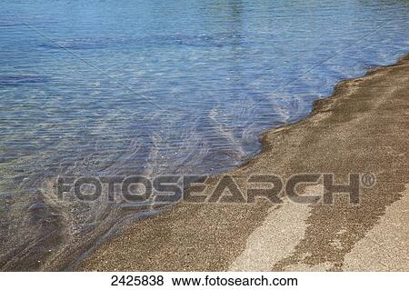 Hawaii, Maui, Clear ocean meeting beach sand in an interesting pattern. View Large Photo Image Stock Photo - Hawaii, Maui, Clear ocean meeting beach sand in an interesting pattern.. Fotosearch