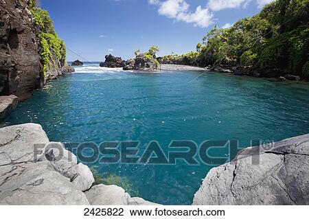 Hawaii, Maui, Hana, View of Venus Pool, Pacific Ocean in distance. View Large Photo Image Stock Image - Hawaii, Maui, Hana, View of Venus Pool, Pacific Ocean in distance.. Fotosearch