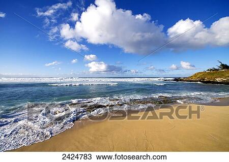 Stock Image - Hawaii, Maui, Ho'okipa Beach Park, Maui's North shore and a small winter swell.. Fotosearch