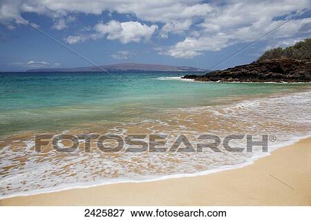 Hawaii, Maui, Makena, Rocky shore of Makena beach, land in distance. View Large Photo Image Stock Photo - Hawaii, Maui, Makena, Rocky shore of Makena beach, land in distance.. Fotosearch