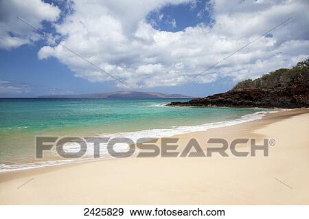 Hawaii, Maui, Makena, Rocky shore of Makena beach, land in distance. View Large Photo Image Stock Photo - Hawaii, Maui, Makena, Rocky shore of Makena beach, land in distance.. Fotosearch