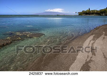 Hawaii, Maui, Olowalu, A view of clear ocean along beach with Lanai in the background. View Large Photo Image Stock Photo - Hawaii, Maui, Olowalu, A view of clear ocean along beach with Lanai in the background.. Fotosearch