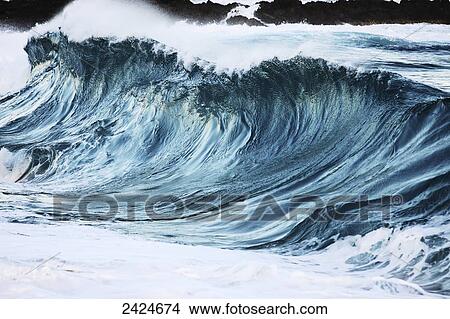 Picture - Hawaii, Oahu, Close up af a beautiful, blue, sunlit wave.. Fotosearch