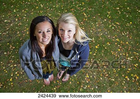 High angle view of a portrait of two teenage girls; Edmonton, Alberta, Canada View Large Photo Image Stock Photo - High angle view of a portrait of two teenage girls; Edmonton, Alberta, Canada. Fotosearch