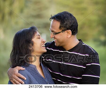 Husband and wife spending quality time together outdoors in a park; Edmonton, Alberta, Canada View Large Photo Image Stock Photograph - Husband and wife spending quality time together outdoors in a park; Edmonton, Alberta, Canada. Fotosearch
