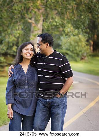 Husband and wife spending quality time together outdoors in a park; Edmonton, Alberta, Canada View Large Photo Image Stock Photography - Husband and wife spending quality time together outdoors in a park; Edmonton, Alberta, Canada. Fotosearch