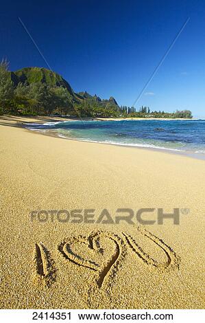 Stock Image - I love you written in the sand on Tunnels Beach; Kauai, Hawaii, United States of America. Fotosearch
