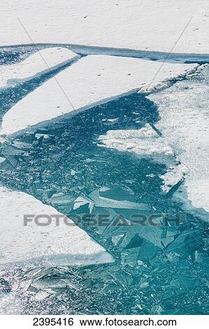 Ice breaking apart on the surface of Portage Lake in springtime with ice crystals in the water, Chugach National Forest; Portage, Alaska, United States of America View Large Photo Image Stock Photograph - Ice breaking apart on the surface of Portage Lake in springtime with ice crystals in the water, Chugach National Forest; Portage, Alaska, United States of America. Fotosearch