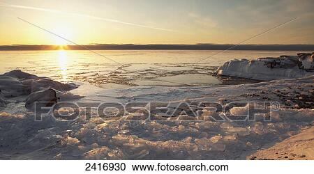 Stock Image - Ice on Lake Superior at sunrise; Thunder Bay, Ontario, Canada. Fotosearch