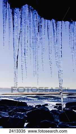 Icicles hanging down a cliff face; United Kingdom View Large Photo Image Stock Photography - Icicles hanging down a cliff face; United Kingdom. Fotosearch