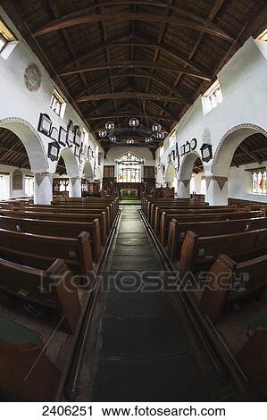 Interior of a church with a centre aisle and wooden pews; Hawkshead, Cumbria, England View Large Photo Image Stock Image - Interior of a church with a centre aisle and wooden pews; Hawkshead, Cumbria, England. Fotosearch