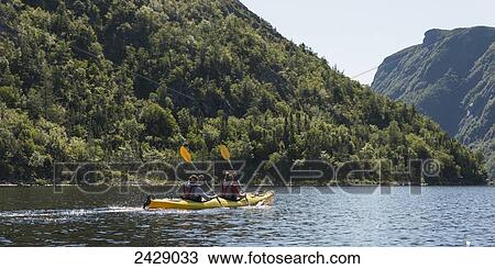Kayaking in Gros Morne National Park; Trout River, Newfoundland, Canada View Large Photo Image Stock Image - Kayaking in Gros Morne National Park; Trout River, Newfoundland, Canada. Fotosearch
