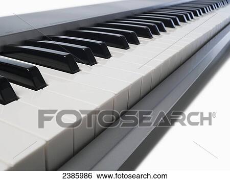 Keys on a piano keyboard View Large Photo Image Stock Photograph - Keys on a piano keyboard. Fotosearch