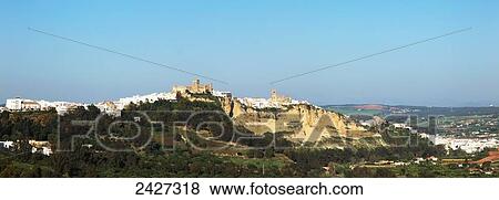 Landscape and the town of Arcos de la Frontera; Andalucia, Spain View Large Photo Image Stock Photo - Landscape and the town of Arcos de la Frontera; Andalucia, Spain. Fotosearch