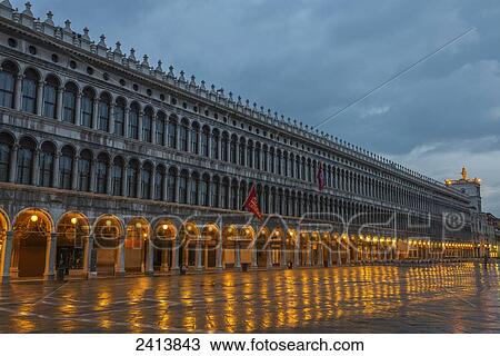 Lighted archways in a row along a building reflected in the wet pavement, Piazza san marco; Venice, Veneto, Italy View Large Photo Image Stock Image - Lighted archways in a row along a building reflected in the wet pavement, Piazza san marco; Venice, Veneto, Italy . Fotosearch