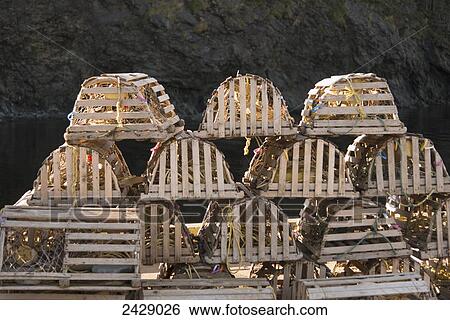 Stock Photograph - Lobster traps in a pile; Trout River, Newfoundland, Canada. Fotosearch